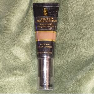 *4 for $28* 1320363 Dark to Deep (Neutral) Black Radiance Tinted Moisturizer